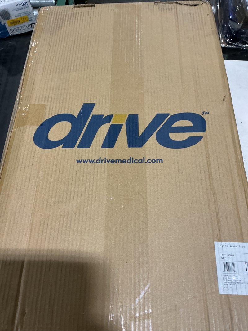 Condition photo showing Good Condition for Drive Medical Overbed Table with Wheels - Secure Height Adjustment for Comfort - Non Tilt Surface - Smooth Rolling Design - Home & Hospital Use - Woodgrain Laminate Top - Silver Vein Silver Vein Table