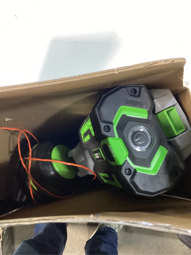 Condition photo showing As Is for ego battery string trimmer kit (battery & charger)