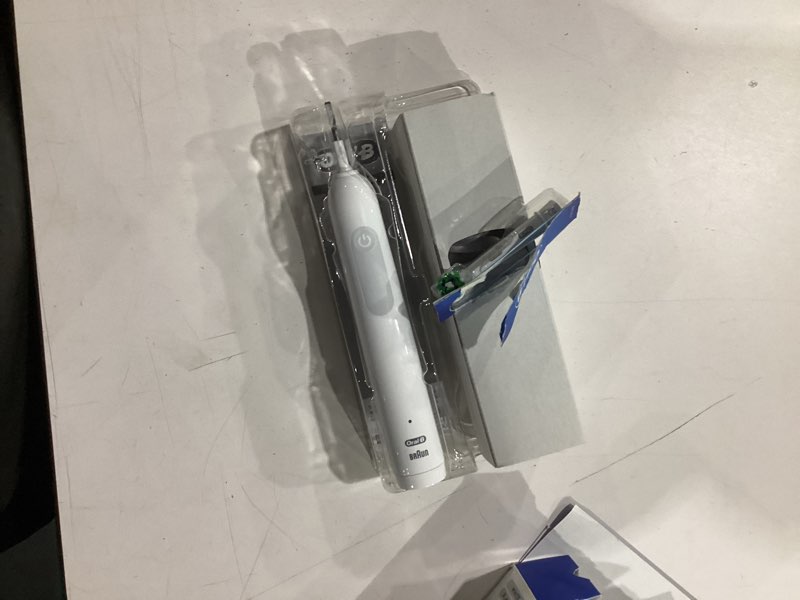 Condition photo showing As Is for oral-b pro 1000 rechargeable electric toothbrush, white