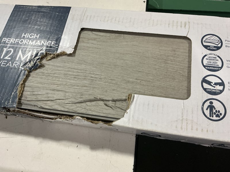 Condition photo showing As Is for style selections charleston oak 12-mil x 7-in w x 48-in l waterproof luxury vinyl plank flooring