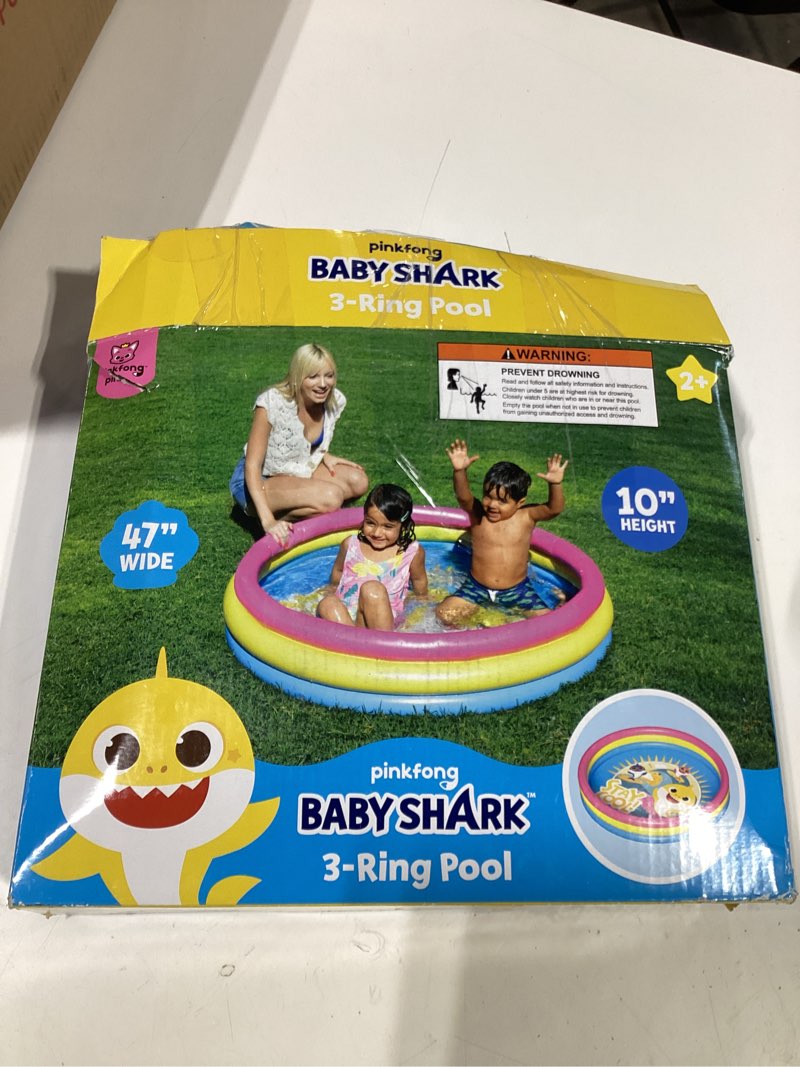Condition photo showing As Is for pinkfong baby shark 3-ring inflatable swimming pool, portable pool for summer play (ages 2+)