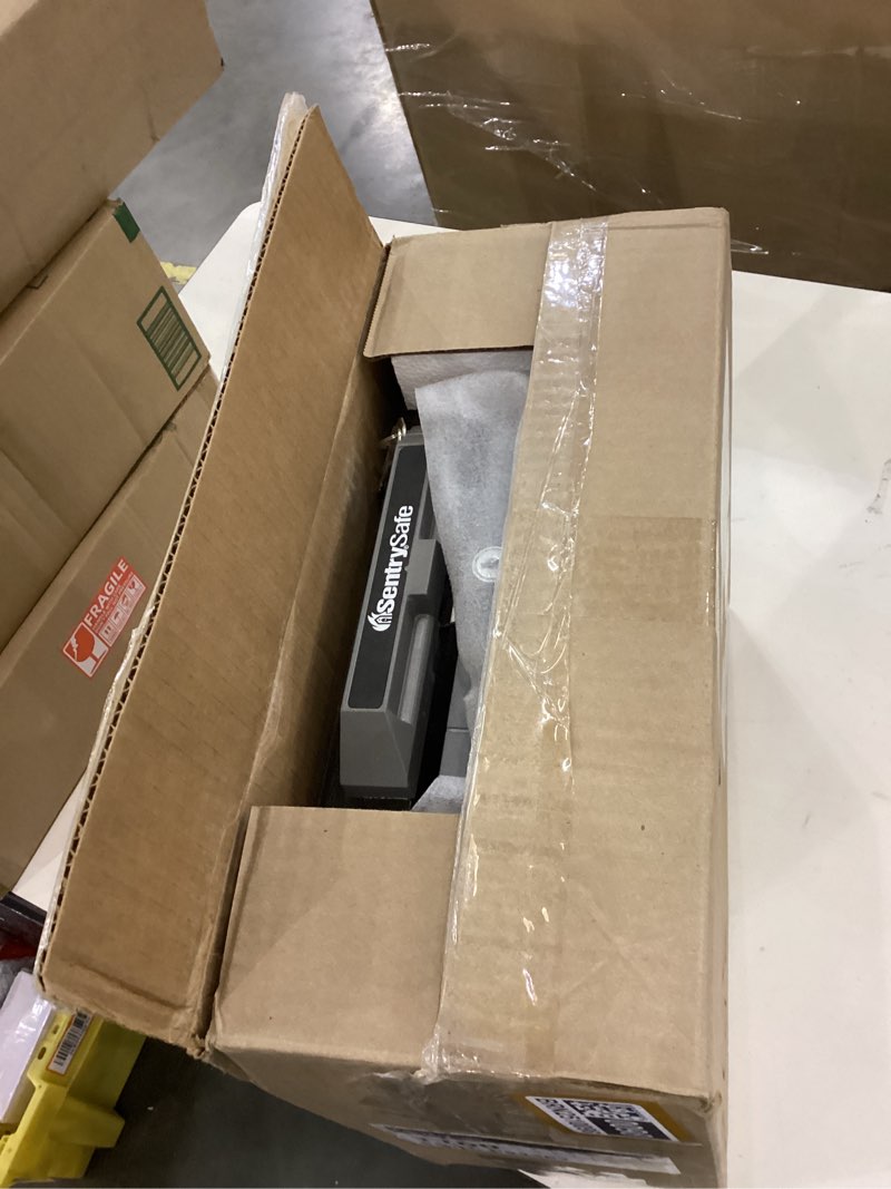 Condition photo showing As Is for SentrySafe Fireproof Safe Box with Key Lock, Chest Safe with Carrying Handle to Secure Money, Jewelry, Documents, 0.25 Cubic Feet, 6.3 x 15.3 x 12.1 Inches, 1160 Fire resistant box 0.25 cu. ft.