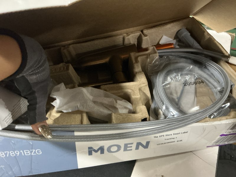 Condition photo showing As Is for moen orivesi bronzed gold one-handle high arc pulldown kitchen faucet with power boost, 87891bzg