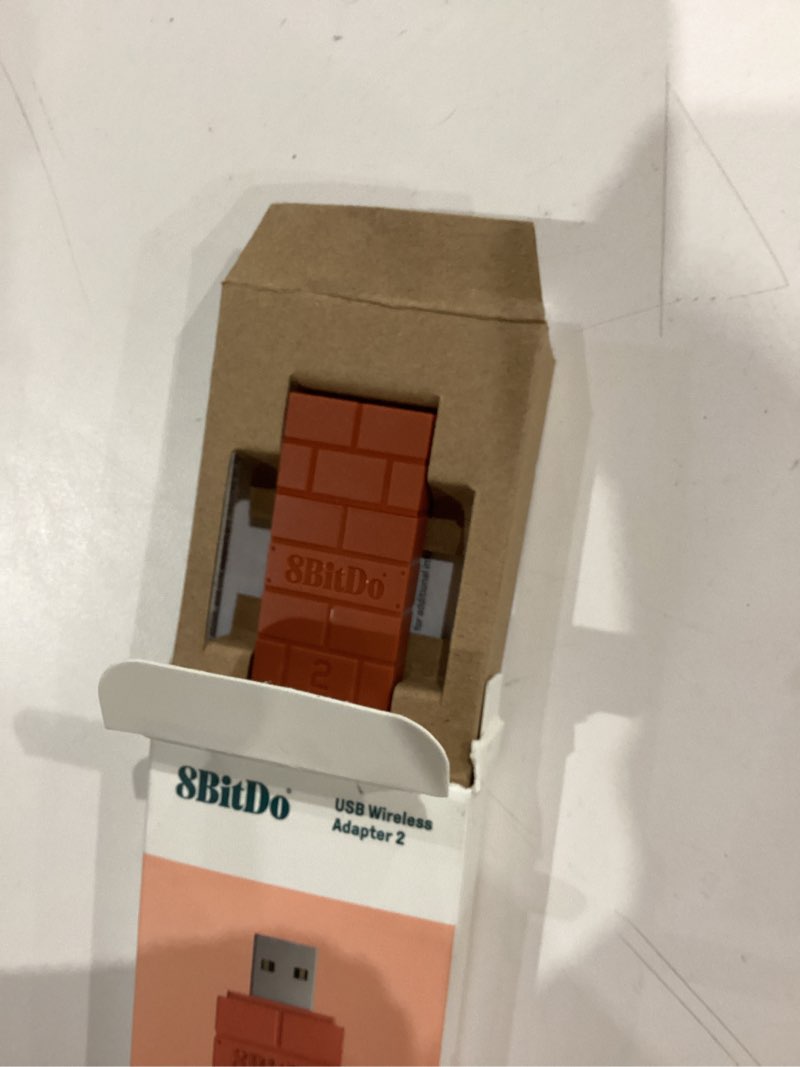 Condition photo showing Good Condition for 8bitdo wireless usb adapter 2 for switch/switch 2, windows pc, mac & raspberry pi, compatible with xbox series x & s controller, xbox one bluetooth controller, switch pro and ps5 controller (brown) usb adapter 2 brown