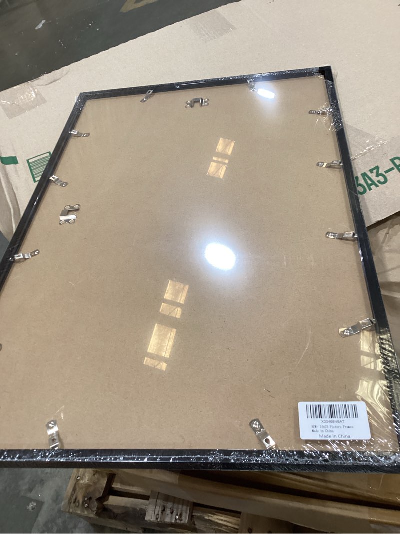 Condition photo showing Good Condition for mcs studio gallery 15x23  poster frame black woodgrain engineered wood, vertical & horizontal wall hanging large picture frame for photos, posters & art prints (1-pack) 1-pack black woodgrain 14x22