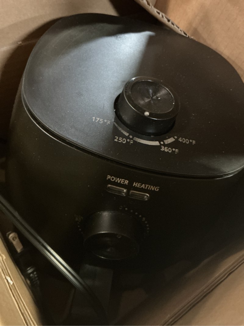 Condition photo showing As Is for mainstays 2.2 qt air fryer in arctic black with non-stick basket