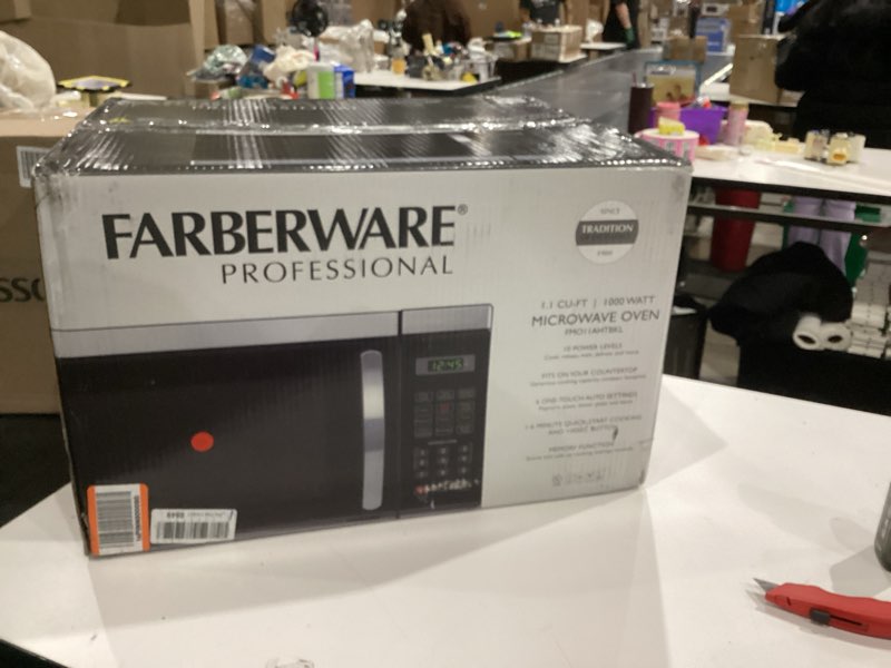 Condition photo showing Good Condition for Farberware 1.1 Cu. Ft. Countertop Microwave Oven – 1000 Watt Power, Auto Cook Settings, Defrost, Easy Clean and Child Safety Lock - Stainless 1.1 Cu. Ft. Stainless