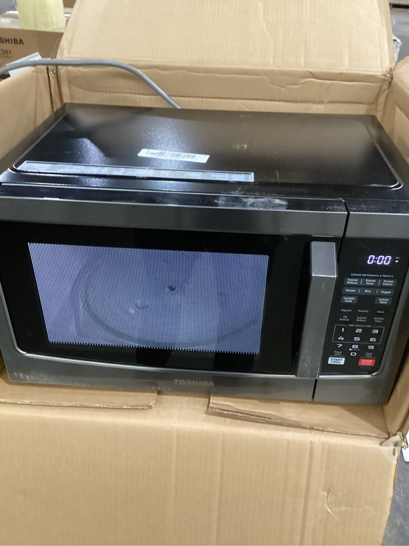 Condition photo showing As Is for TOSHIBA EM131A5C-BS Countertop Microwave Ovens 1.2 Cu Ft, 12.4" Removable Turntable Smart Humidity Sensor 12 Auto Menus Mute Function ECO Mode Easy Clean Interior Black Color 1000W 1.2 Cu.Ft. Black