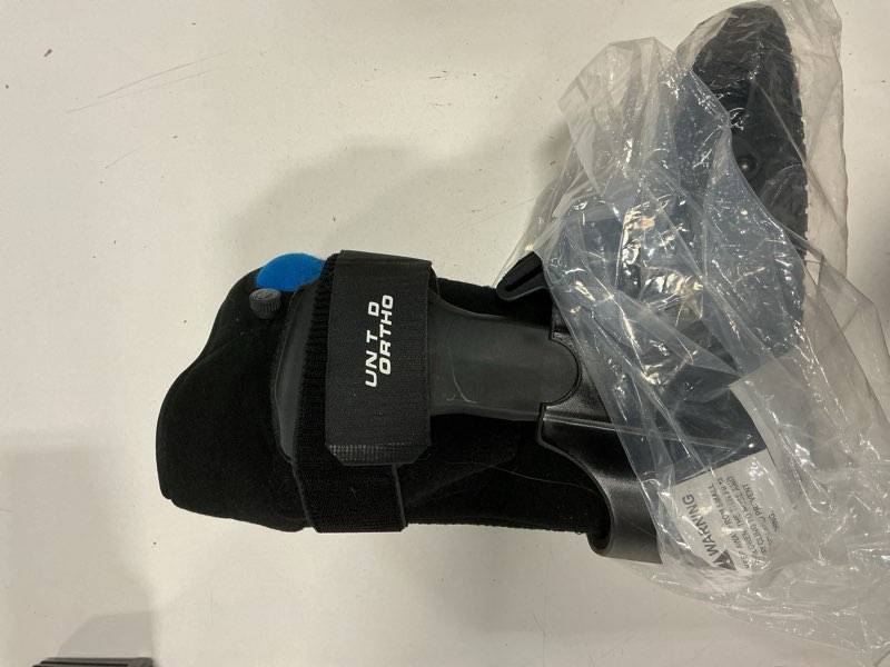 Condition photo showing As Is for united ortho short air cam walker fracture boot, large, black black large boot