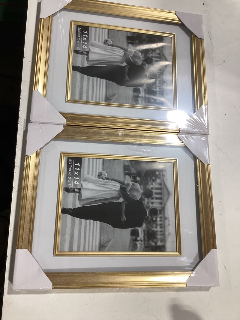 Condition photo showing Good Condition for yaetm 11x14 gold picture frame with decorative inner frame & tempered glass, display 8x10 photos with mat on wall - portrait or landscape - ideal for office & home décor (vintage gold, 2 pack) 11x14 - 2 pack vintage gold