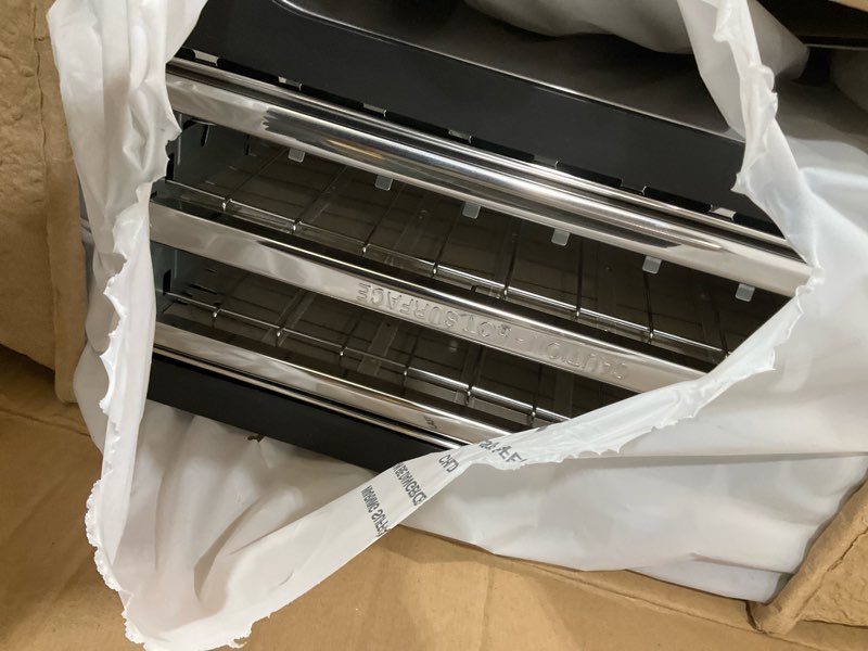 Condition photo showing As Is for Elite Gourmet ECT-3100 Long Slot 4 Slice Toaster, Reheat, 6 Toast Settings, Defrost, Cancel Functions, Built-in Warming Rack, Extra Wide Slots for Bagels & Waffles, Stainless Steel & Black 4 Slice Matte Black
