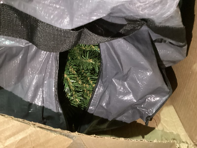 Green prelit christmas tree in a bag 