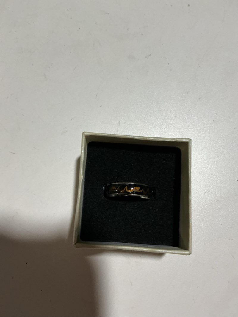 Condition photo showing As Is for jeykay color changing titanium/stainless steel mood ring, ekg w/hearts design, gift box included. change color 10