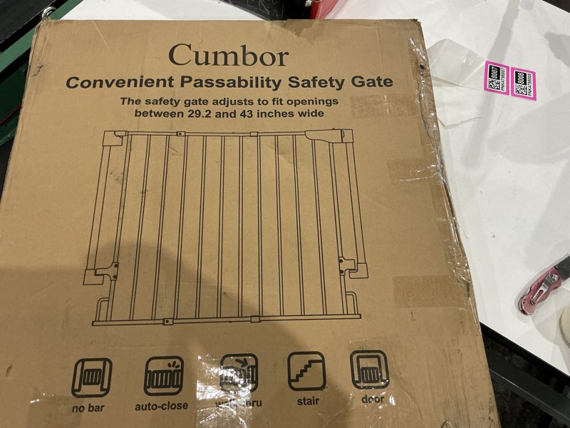 Condition photo showing As Is for cumbor child or elderly safety gate 29.2 to 43 inches, new in the box