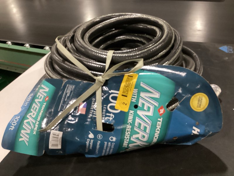 Condition photo showing As Is for neverkink teknor apex 5/8-in x 100-ft heavy-duty kink free vinyl gray coiled hose