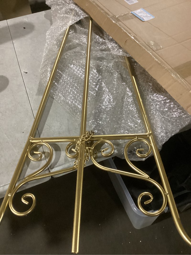 Condition photo showing As Is for 55.12" gold easel stand for wedding signs with bow design, metal easel display stand with adjustable hook & chain, heavy duty easel for mirror, sign, wedding, picture, frame (no installation required) graceful bow top