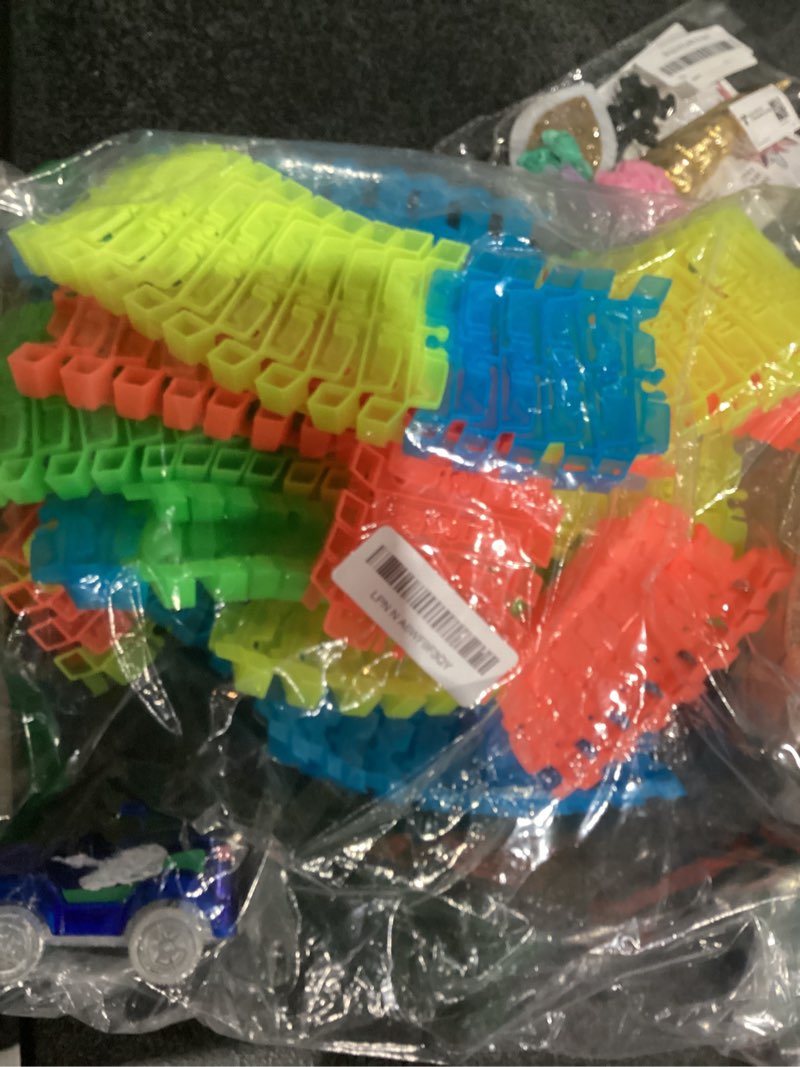 Condition photo showing As Is for ontel magic tracks 10 foot glow in the dark bendable flexible racetrack with led light-up race car, educational playset birthday gift for ages 3+