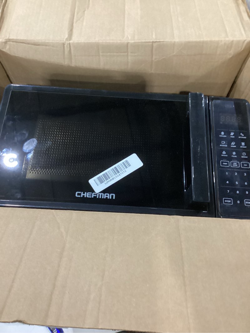 Condition photo showing As Is for “Not Tested” Chefman Countertop Microwave Oven 0.7 Cu. Ft., 700 Watts with 10 Power Levels, 6 Cooking Presets with One-Touch Express Cook, Eco Mode, Child Safety Lock, & Mute Button - Black