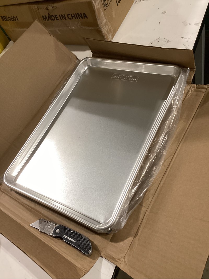 Condition photo showing As Is for Nordic Ware Naturals Half Sheet - USA Made Aluminum Commercial Quality Sheet Pan for Baking or Roasting, Encapsulated Galvanized Steel Rim Prevents Warping, 2-Pack 2pk Half Sheet