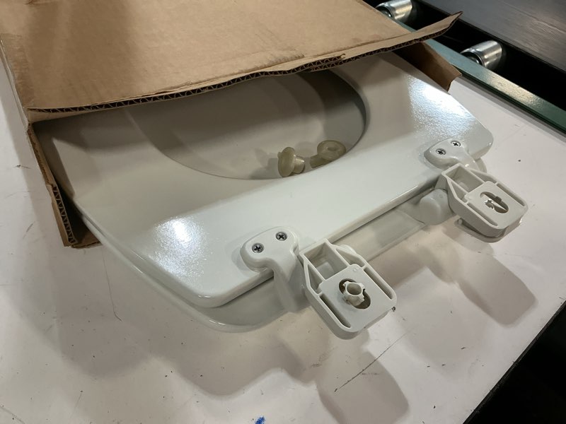 Condition photo showing As Is for Mayfair NextStep2 Toilet Seat with Built-In Potty Training Seat, Slow-Close, Removable that will Never Loosen, Elongated, White Elongated (1-Pack) 1-Pack