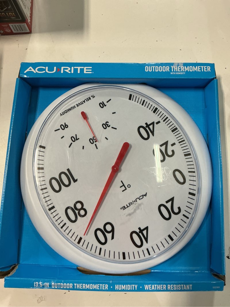 Condition photo showing As Is for acurite 13.5  white thermometer with humidity gauge; 13.5 x 14.5 x 1.8  not battery powered  plastic