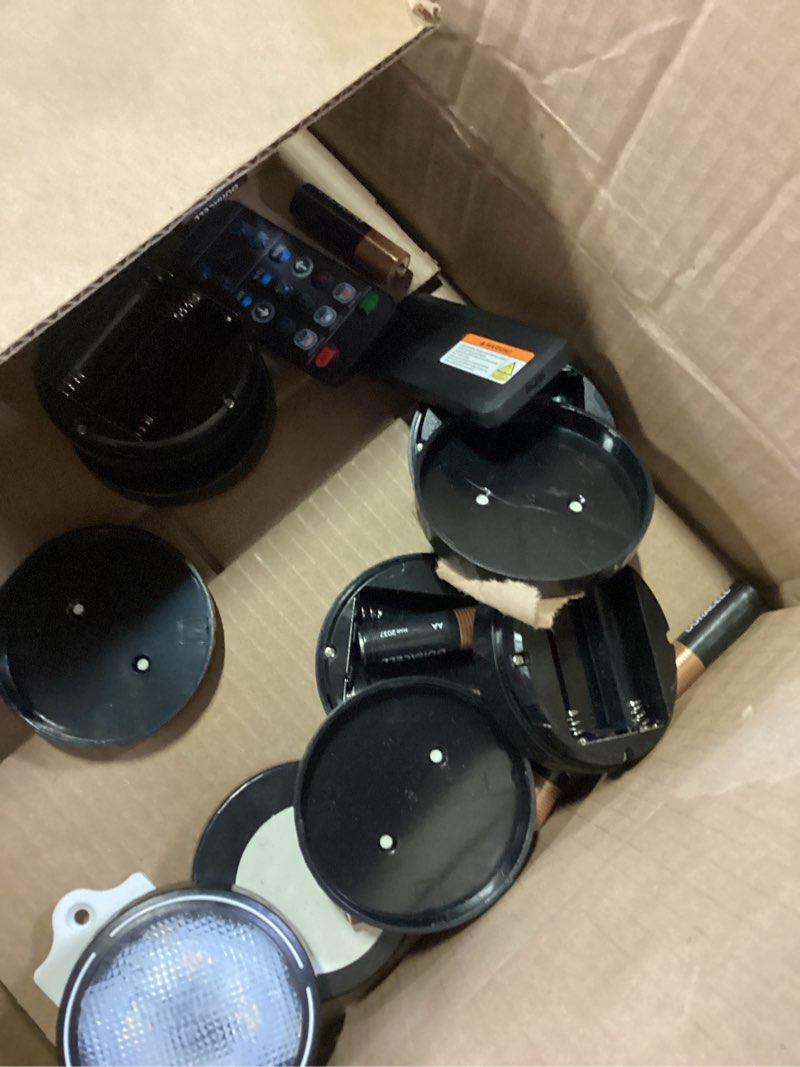 Condition photo showing As Is for tecomlight led puck lights with remote control, battery operated wireless closet light, under cabinet lighting stick on tap push lights, color changing under counter light for kitchen, 6 pack - black 6 pack black