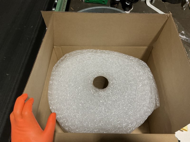 Condition photo showing New/Like New for amazon basics bubble cushioning wrap for moving, packing, shipping and storage, heavy duty protection for fragile items, 12-inch x 100-foot long roll, large 5/16", clear clear 12 inch x 100 ft