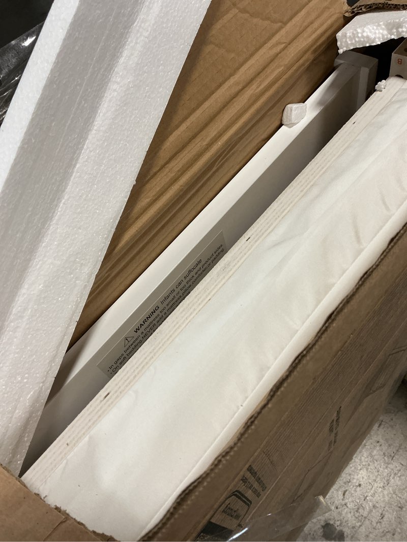 Condition photo showing As Is for dream on me edgewood 4-in-1 convertible mini baby crib in white greenguard gold & jpma, non-toxic, compact 40×25×33? design, converts to mini daybed & twin bed (rails to buy) 1? mattress pad white modern