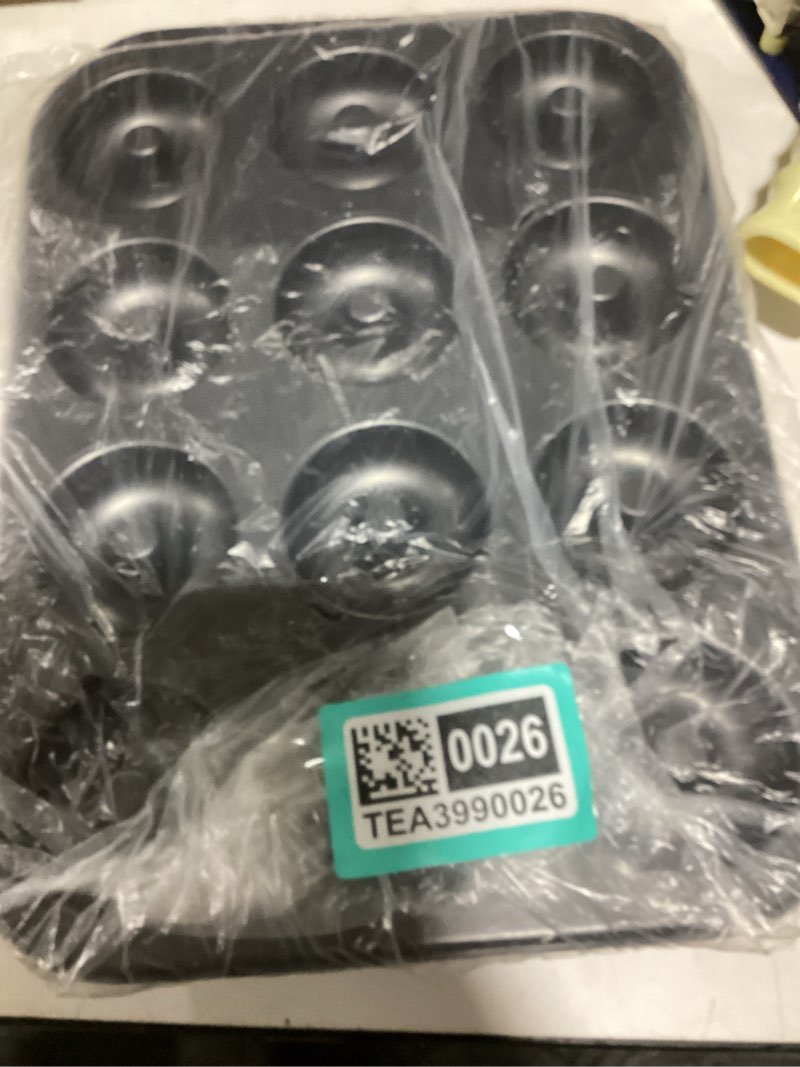 Condition photo showing New/Like New for wilton small donut pan 12-cavity, steel 12-cavity mini