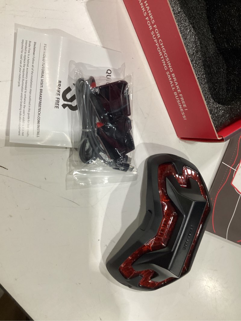 Condition photo showing New/Like New for brake free helmet light - smart wireless motorcycle lights- weatherproof led motorcycle helmet light - lightweight & aerodynamic design - smart brake detection - single button operation - black