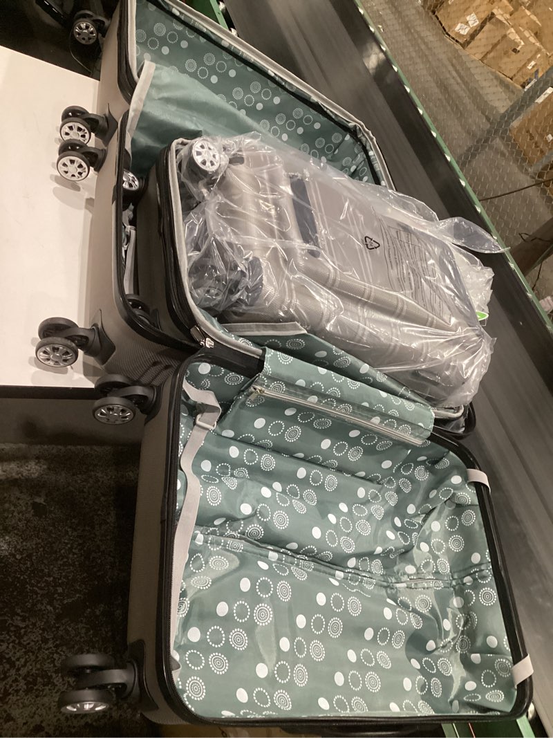 Condition photo showing Good Condition for rockland melbourne hardside expandable spinner wheel luggage, silver, 3-piece set (20/24/28) silver 3-piece set (20"/24"/28")