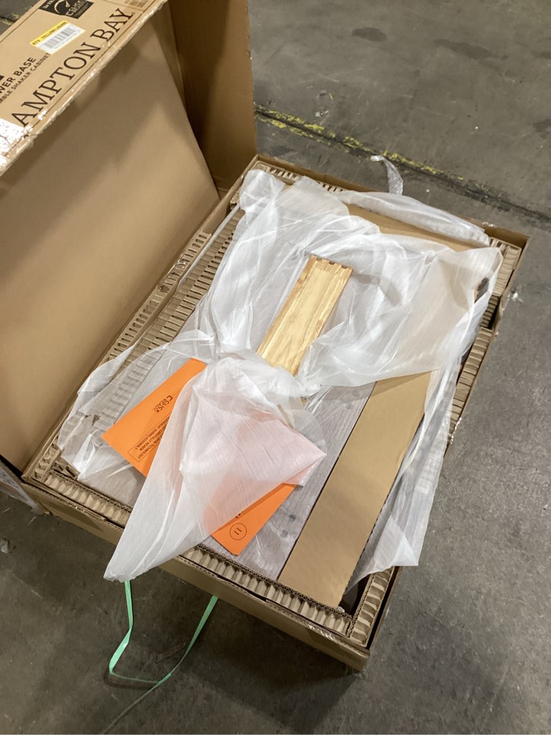 Condition photo showing As Is for 18 in. w x 24 in. d x 34.5 in. h ready to assemble drawer base kitchen cabinet in unfinished with clickready technology