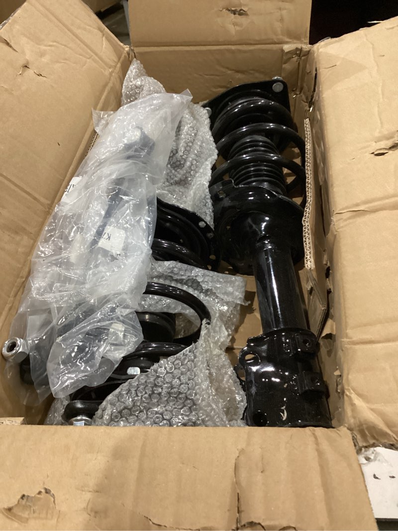 Condition photo showing As Is for strut assembly for unknown car