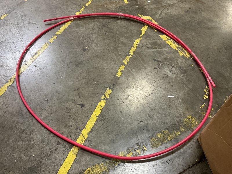 Condition photo showing As Is for Long red plastic tube, size unknown 