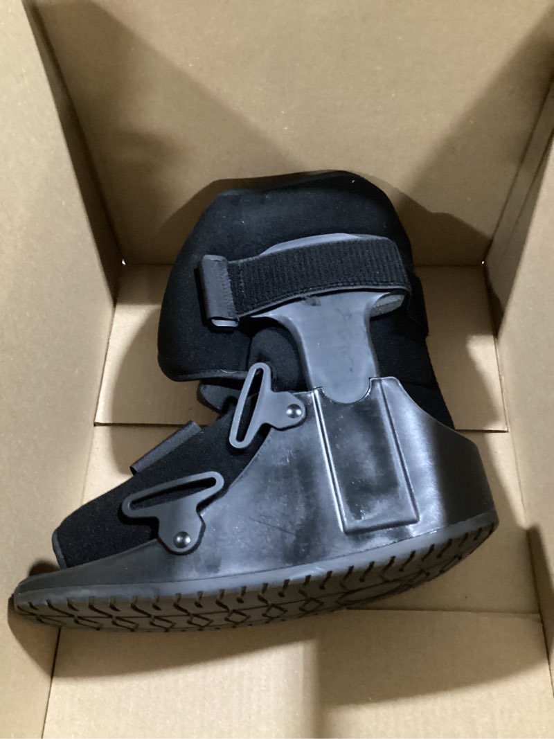 Condition photo showing As Is for united ortho short air cam walker fracture boot, large, black black large boot