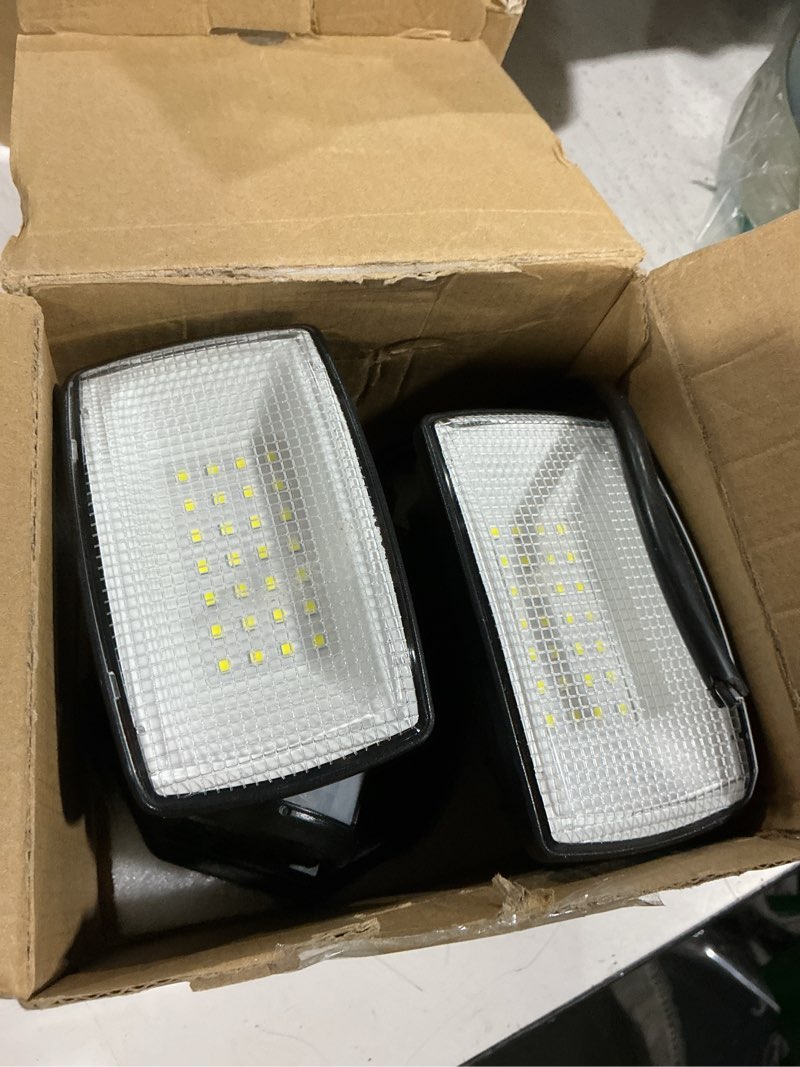 Condition photo showing As Is for onforu 32w plug in motion sensor lights outdoor, 3200lm motion flood light dusk to dawn, ip65 waterproof led security light outside, 2 heads motion activated wall light for garage, porch, yard - black