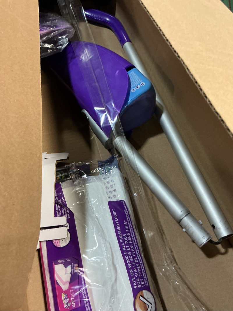 Condition photo showing As Is for swiffer wetjet hardwood and floor spray mop cleaner starter kit, includes: 1 power mop, 10 pads, cleaning solution, batteries 1 kit cleaner kit