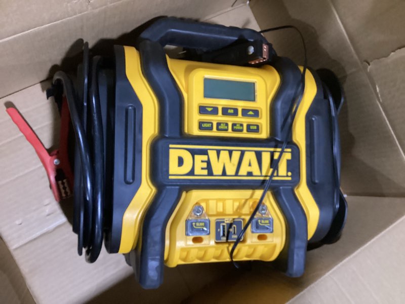 Condition photo showing As Is for DEWALT DXAEPS14 2000 Peak Battery Amp 12V Automotive Battery Booster Jump Starter/Power Station with 120 PSI Compressor, 500W AC Power Inverter, and 15W USBa & 25W USB Ports