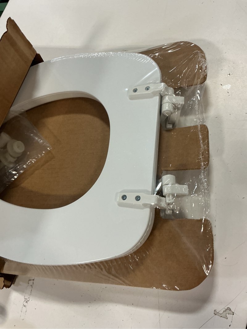 Condition photo showing Good Condition for Mayfair Padded Toilet Seat, Cushioned Soft Vinyl over Wood Core Seat, Secure Hinges, Easy Clean, Elongated, White Elongated White Toilet Seat