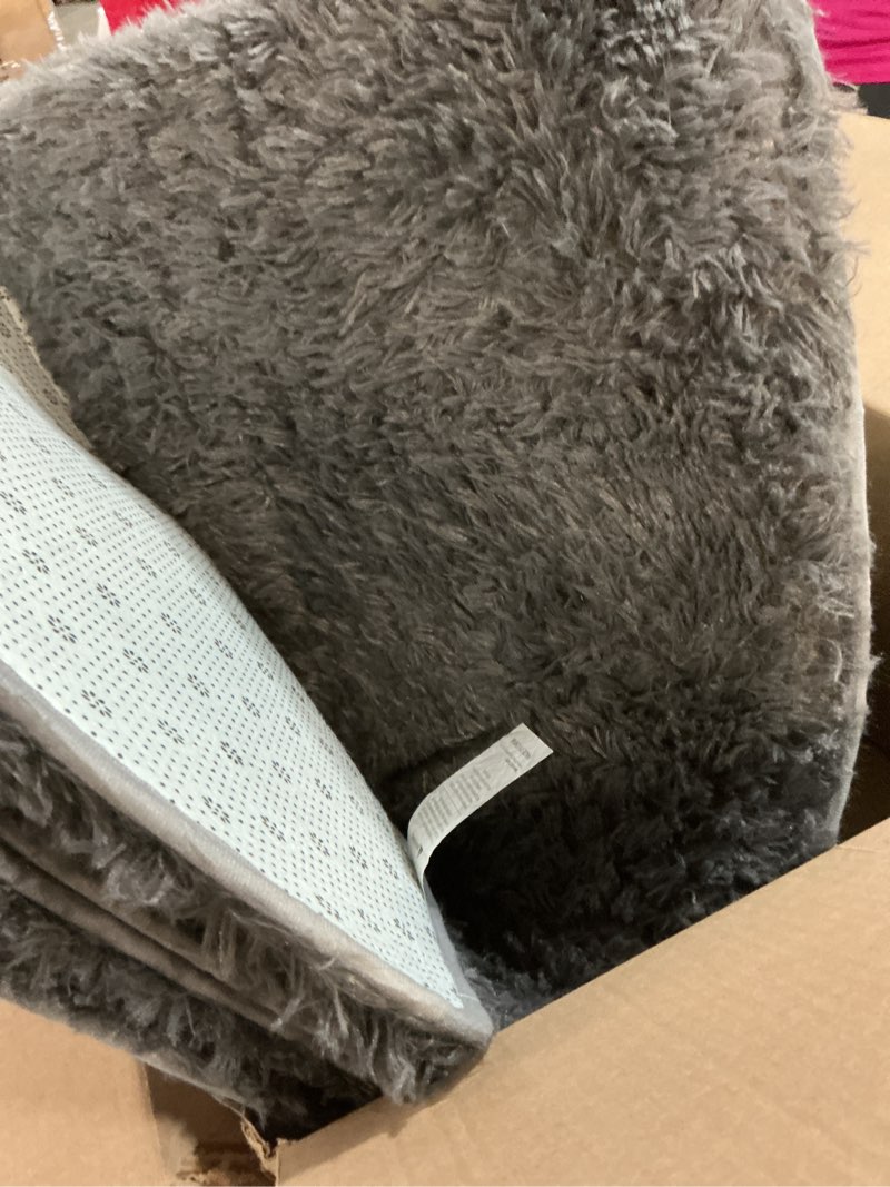 Condition photo showing Good Condition for OLANLY 5x8 Machine Washable Large Area Rugs for Living Room, Bedroom, Soft Fluffy Shaggy Bedside Rug, Indoor Floor Carpet for Kids Girls and Boys, Dorms, Nursery, Home Decor Aesthetic, Grey 5x8 ft Grey