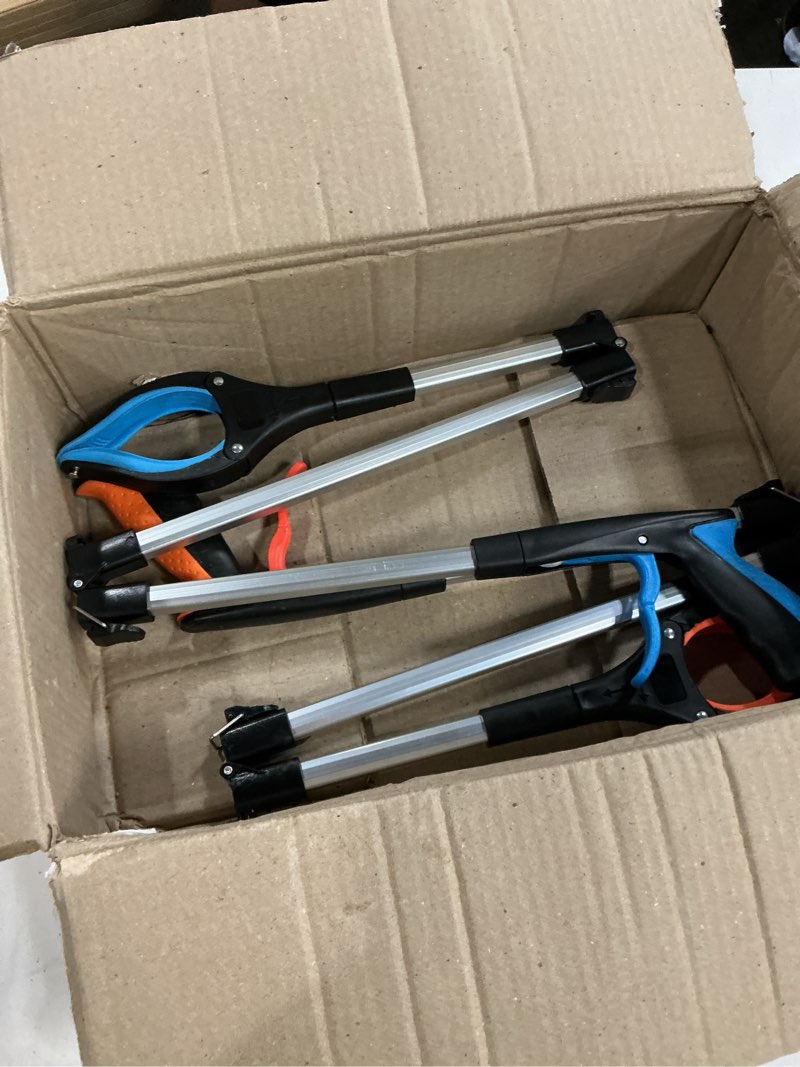 Condition photo showing As Is for set of 2 collapsible pincer grabbers (missing parts)
