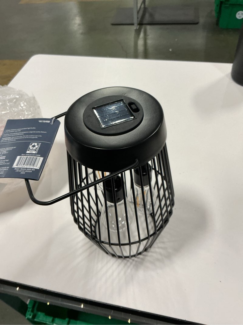 Condition photo showing As Is for Style Selections 6.5-in x 10.5-in Black Metal Solar Outdoor Decorative