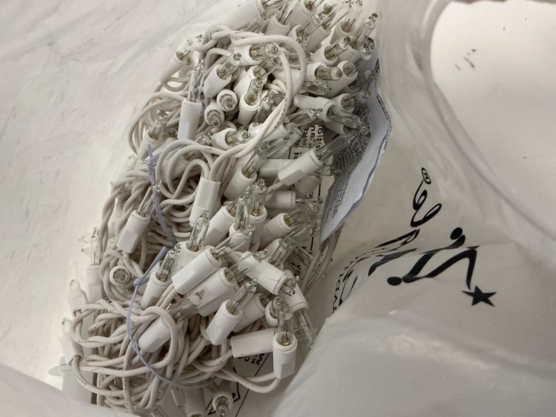 Condition photo showing As Is for Kringle Traditions 8.5 Ft 150 Clear Icicle Christmas Lights – White Wire Indoor/Outdoor String Lights for House and Roof Decorations