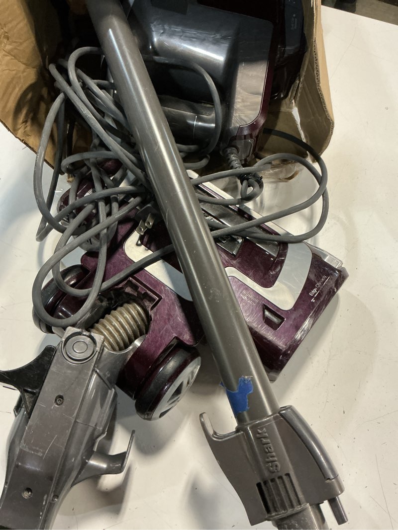 Condition photo showing As Is for shark hv322 rocket pet plus corded stick vacuum with led headlights, xl dust cup, lightweight, perfect for pet hair pickup, converts to a hand vacuum, with (2) pet attachments, bordeaux/silver rocket deluxe w/ headlights