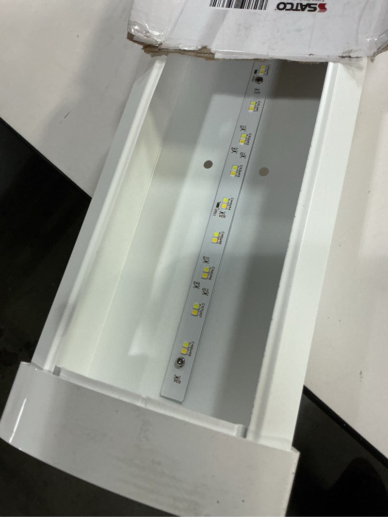 Condition photo showing As Is for Satco 65-1215 4FT LED Ceiling Wrap Light with Motion Sensor, 39W, CCT Selectable 2700K–5000K, 3400 Lumens, 120-277V, White Steel Housing, Non-Dimmable, Damp Rated