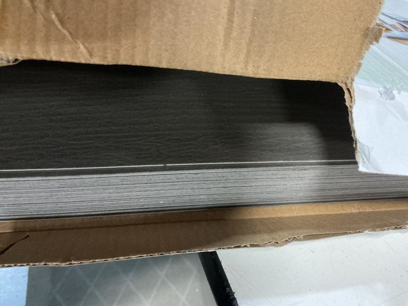 Condition photo showing New/Like New for peel and stick vinyl flooring 36 pack 54 sq.ft, waterproof vinyl flooring peel and stick for office, living room, bathroom, kitchen - unique design, easy to install floor black 36 x 6 x 0.1 inches black 36