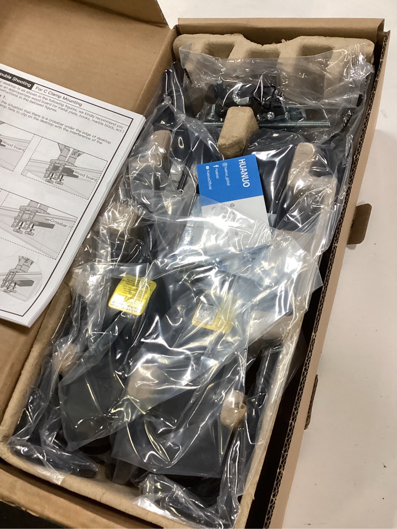 Condition photo showing New/Like New for HUANUO Dual Monitor Stand, Fully Adjustable Gaming Monitor Desk Mount for 13–32? Computer Screens, Full Motion VESA 75x75/100x100 with C-Clamp & Grommet Base, Each Arm Holds 4.4 to 19.8 lbs Black 13-32 Inch