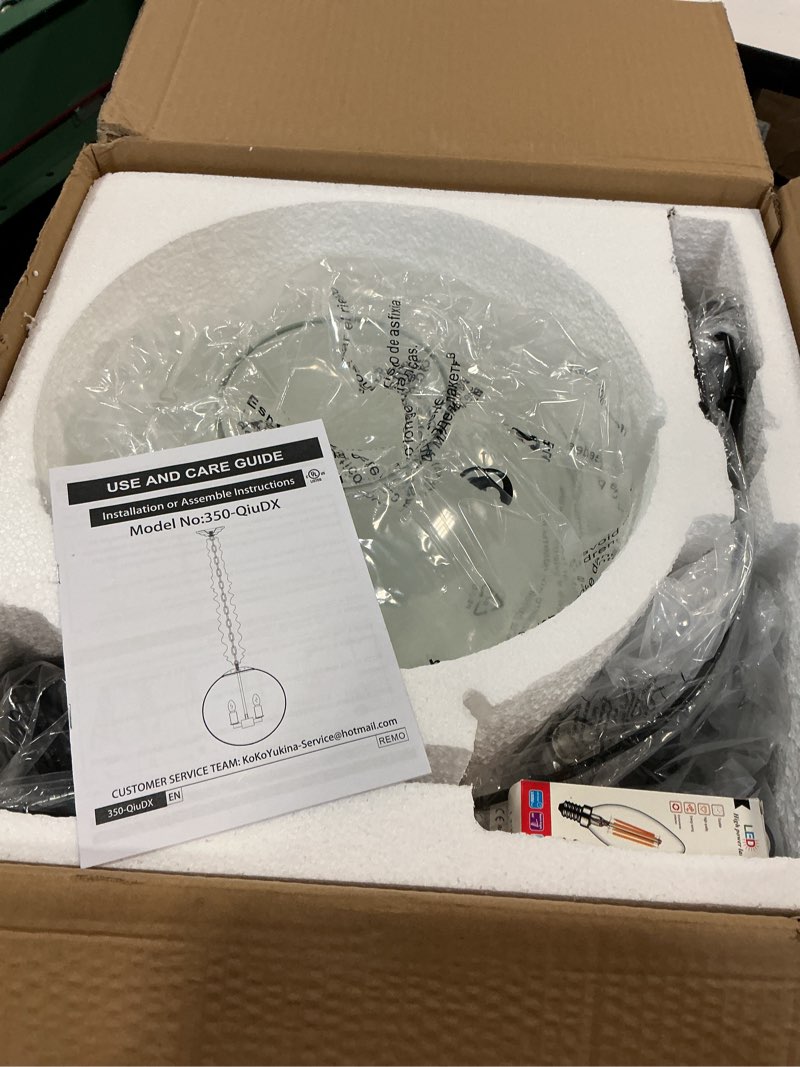 Condition photo showing As Is for KoKo&Yukina 13.7" Black Globe Pendant Light Mid Century Pendant Light Clear Glass Pendant Lights Kit