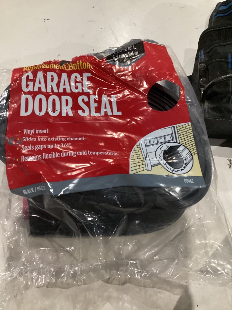 Condition photo showing As Is for m-d building products black vinyl replacement bottom for garage doors 216 in. l x 1 in.