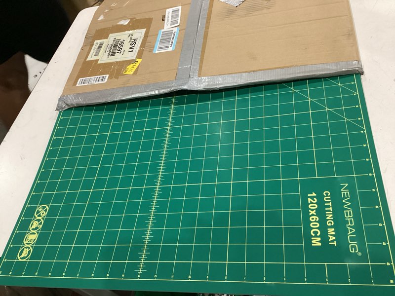 Condition photo showing Good Condition for newbraug 23'' × 47'' large self healing cutting double sided 5-ply mat, big cutting board for rotary cutting, quilting, sewing, craft, fabric & scrapbooking(green/black) green & black 47"l x 23"w